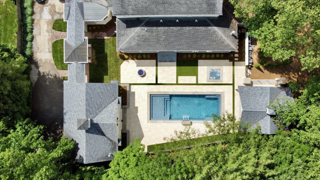 overhead view of inground pool and hot tub